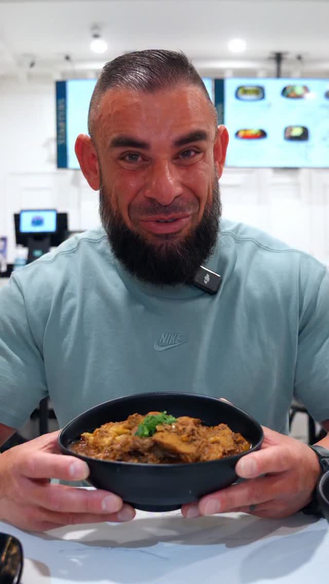 Feast in the Middle East owner presenting a freshly prepared dish