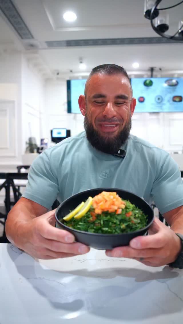 Feast in the Middle East owner presenting fresh tabouli